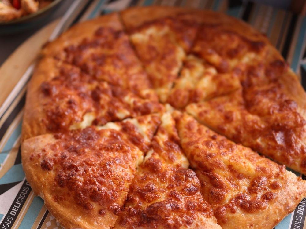 Classic cheese-loaded pizza with a golden crust