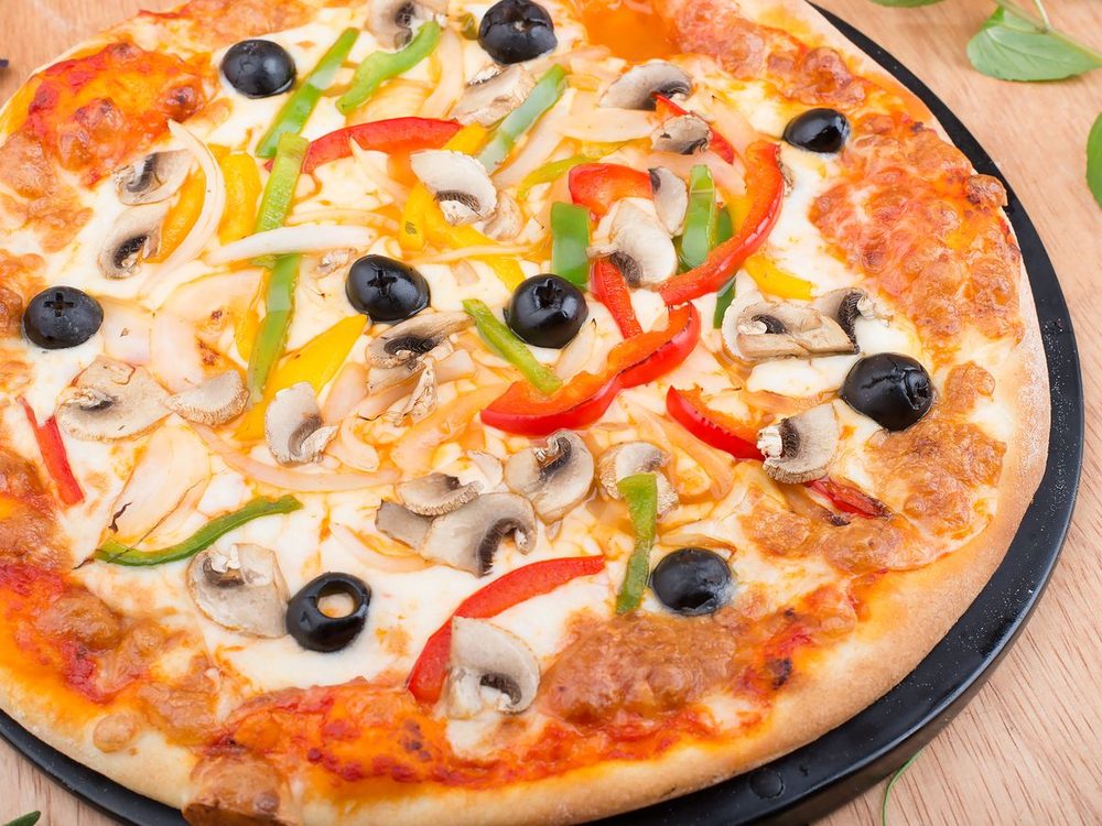 Vegetarian pizza with mushroom, capsicum, onion and olives